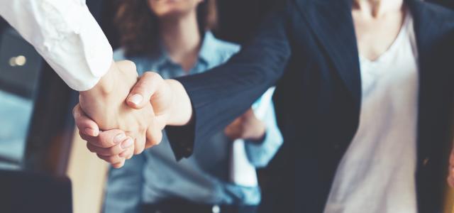 Business People Shaking Hands in the Office